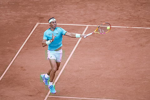 Rafael Nadal plays a forehand return against Leo Borg
